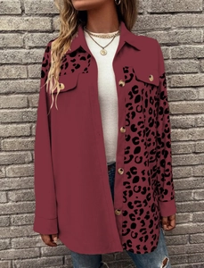 Detailed view of the leopard print patchwork and buttons on the burgundy shirt jacket