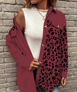 Detail of burgundy button-down shirt jacket with stylish leopard print patchwork sleeve