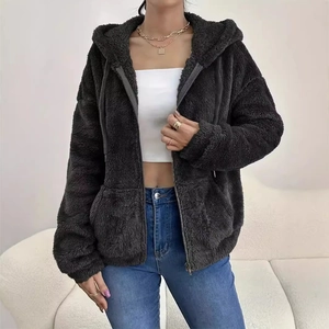 Detail of soft charcoal grey teddy fleece texture on women's hooded zip-up jacket