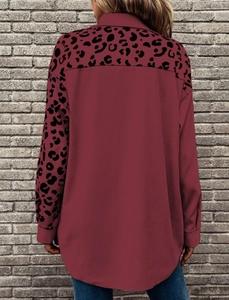 Back view of leopard print patchwork jacket showing long sleeves and loose fit design