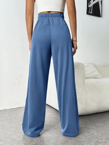 Rear view of high waist wide leg lounge pants in soft blue grey with elastic waistband