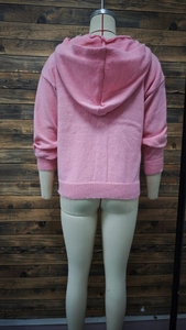 Close-up of pink hooded cardigan showing knit texture and ribbed cuffs from the back