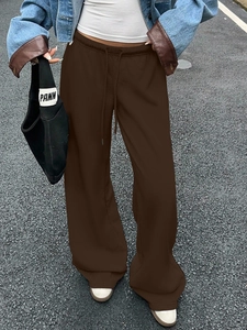Deep brown wide-leg sweatpants with elastic drawstring waist for a casual sporty look