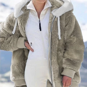 Detail of premium fuzzy faux fur hooded jacket with zip closure and ribbed cuffs