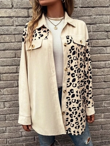 Detail of leopard print patchwork and chest pockets on long sleeve corduroy jacket