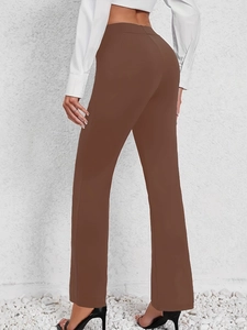 Rear view of high-waisted dark brown straight-leg trousers with slimming fit silhouette
