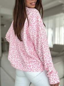 Women's white long sleeve sweatshirt with pink leopard print and ribbed cuffs