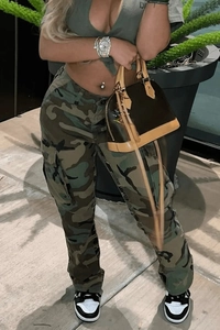 Close-up of camouflage cargo pants featuring large side pockets and street style design