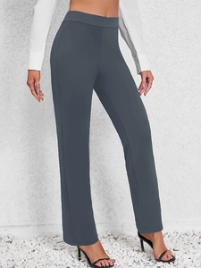 Detail of high waist dark grey straight trousers with seamless fit and sleek profile