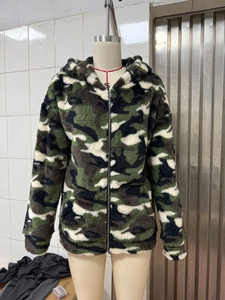 Close-up of double-sided camouflage plush hoodie with zip closure and ribbed cuffs