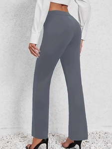 Detail shot of grey high-waisted flared trousers with premium slim fit tailoring