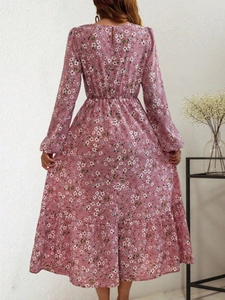 Back view of pink floral long sleeve maxi dress with high waist and ruffle hem details