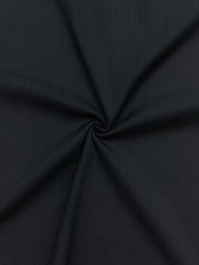 Close-up detail of soft black ribbed knit fabric texture with vertical stripe structure