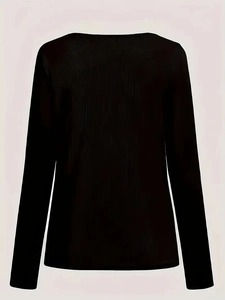 Detailed view of black long sleeve top featuring fine ribbed knit texture and soft fabric