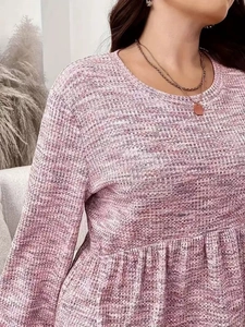 Detail of pink tie-dye waffle knit fabric with textured ruffles and loose fitting design