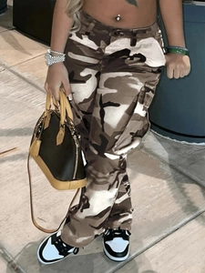 Detail view of brown camouflage cargo pants featuring side pockets and a relaxed straight cut
