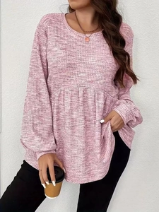 Detail of waffle knit fabric and ruffled hem on pink tie-dye long sleeve top