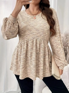Women's beige waffle knit peplum top with lantern sleeves and a comfortable round neck