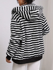 Women's black and white striped oversized fleece hoodie with cozy plush texture