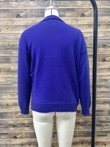 Detailed back view of royal blue wool blend cardigan with ribbed hem and drop shoulder design