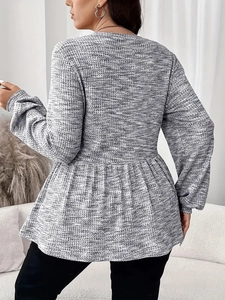 Back view of gray waffle knit long sleeve top with elegant peplum hem for women