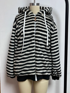 Women's fluffy black and white striped hooded jacket with zipper and soft fleece texture