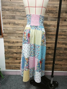 Bohemian floral patchwork maxi skirt with elastic smocked waist and multi-pattern fabric