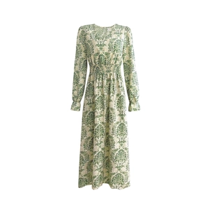 Detail of V-neck long sleeve dress with vintage green damask print and elastic waist