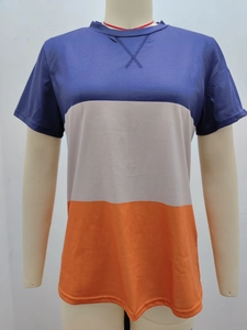 Detail of color-block short sleeve tee with decorative X-stitch on the crew neckline