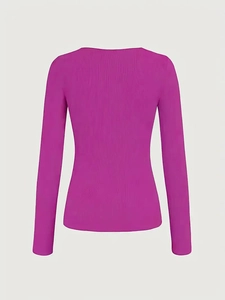 Detail of fuchsia ribbed knit texture and smooth stitching on a long-sleeve slim-fit top