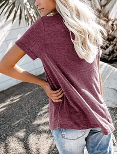 Outdoor shot of the back view of a burgundy short-sleeved V-neck T-shirt for women