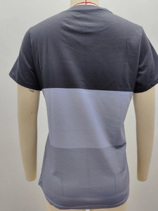 Detail of color-blocked short sleeve t-shirt featuring three-tone gray panels and round neck