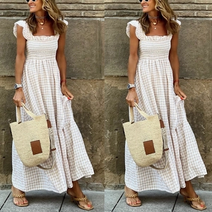 Detail of smocked bodice and tiered gingham patterns on a summer midi dress