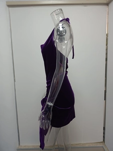Detailed texture of purple velvet dress showing side ruching and elegant drawstring ties