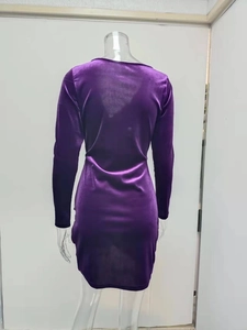 Rear view of purple velvet V-neck long sleeve mini dress with a slim fit bodycon cut