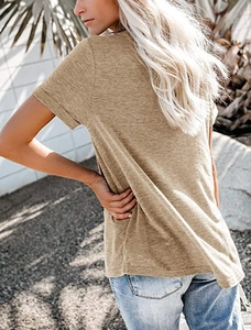 Outdoor back view of a loose khaki V-neck t-shirt featuring rolled sleeves and breathable fabric