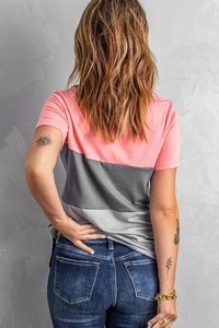 Back view of a women's three-color patchwork short sleeve T-shirt with denim jeans