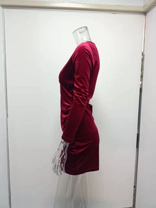 Detailed side view of dark red velvet dress with sexy V-neck and ruched side detail