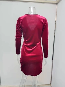 Detail of dark red velvet mini dress showing back cut and shimmering elastic fabric