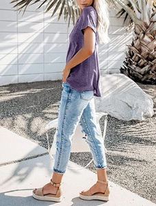 Detail of purple V-neck short sleeve T-shirt with side slit and casual summer texture