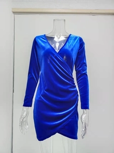 Detailed view of royal blue velvet dress with V-neck and ruched wrap waistline