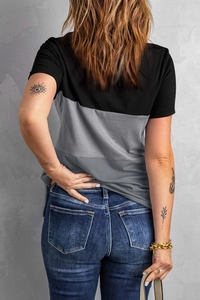 Rear view of a casual color-block t-shirt with grey panel and classic denim jeans