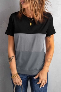 Close-up of three-tone color block stitching and fabric texture on a women's casual T-shirt