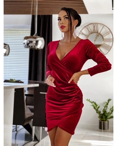 Detail of elegant dark red velvet wrap dress featuring V-neckline and side ruching texture