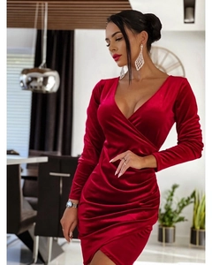 Detail of burgundy velvet V-neck dress featuring wrap design and ruched waist textures