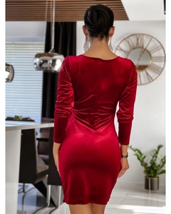 Rear view of tight red velvet long-sleeve mini dress showing high waist and slim fit curve