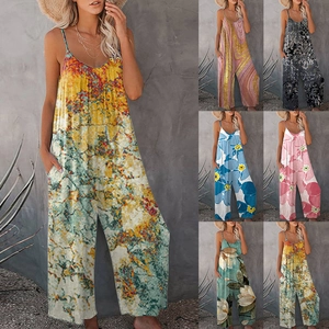 Detail showing various boho tie-dye patterns and loose wide-leg fit of the jumpsuit