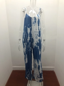 Detail of blue and white tie-dye wide-leg jumpsuit with slim straps and V-neckline