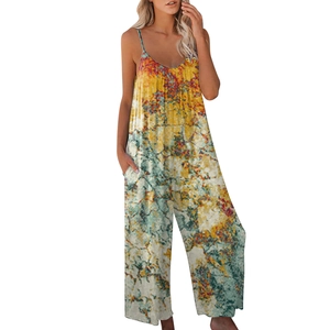Detailed close-up of vibrant tie-dye pattern and side pocket on the wide leg jumpsuit