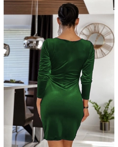 Detail view of the back of a deep green velvet V-neck dress with bodycon fit and long sleeves